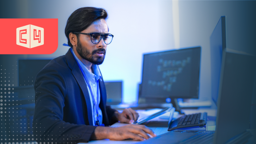 FinOps practitioner reviewing cloud spend at workstation
